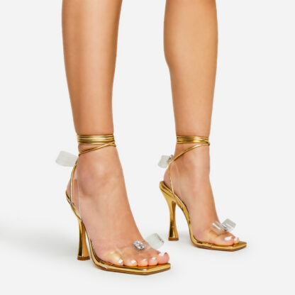 Essence Lace Up Diamante Perspex Bow Detail Square Toe Heel In Gold Metallic Faux Leather, Gold